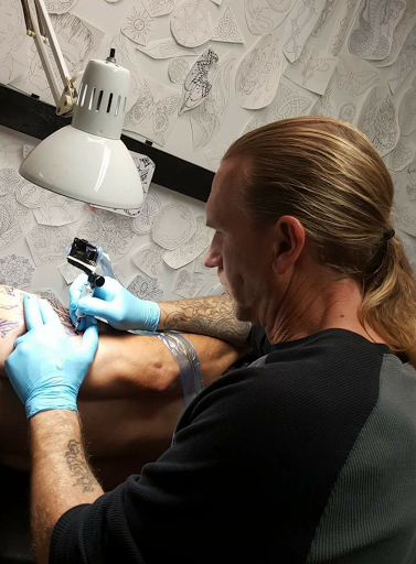 Explore side head tattoo ideas, creative tattoo ideas in New Bern, available at Firehouse Tattoo.