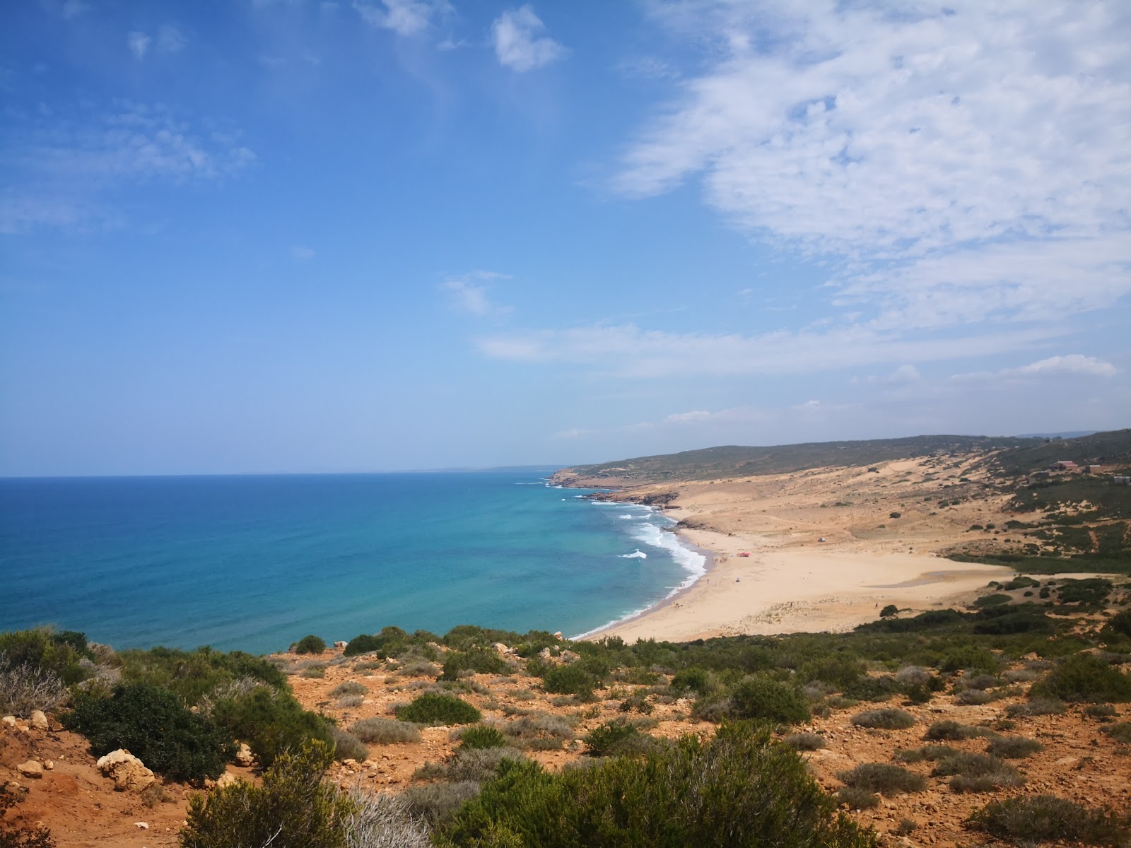 Foto de Plage Mangaa con arena fina beige superficie