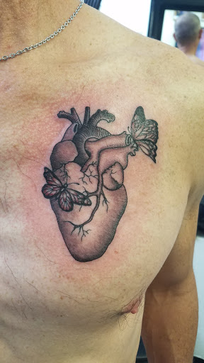 Explore bowhunting tattoo ideas, creative tattoo ideas in Albuquerque, available at Sachs Body Modification