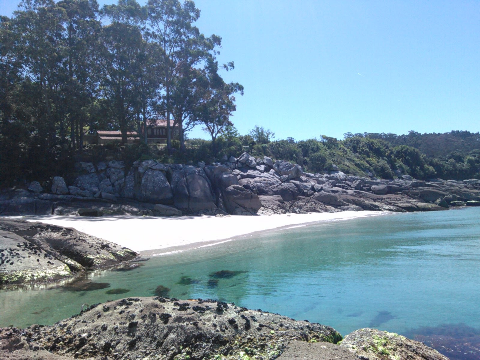 Foto di Praia Sartaxens con una superficie del sabbia beige fine