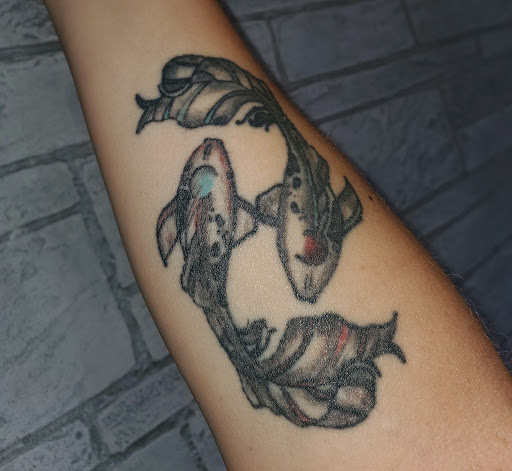 Explore marriage ring tattoo ideas, creative tattoo ideas in College Station, available at The Ineffable Tattoo Experience