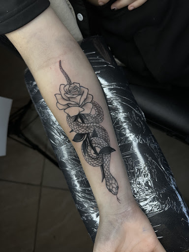 Explore ouroboros tattoo ideas, creative tattoo ideas in Zephyrhills, available at The Tattoo Haven