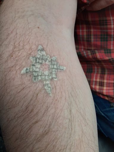 Explore fine line spine tattoo ideas, creative tattoo ideas in Saint Paul, available at Fearless Tattoo Removal