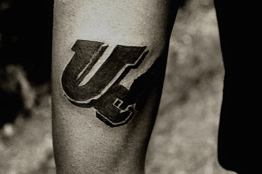 Explore minimalist dog tattoo ideas, creative tattoo ideas in Dayton, available at Uppity Tattoos