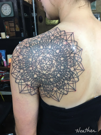 Explore aster flower tattoo ideas, creative tattoo ideas in Phoenix, available at Lady Luck Tattoo Phoenix