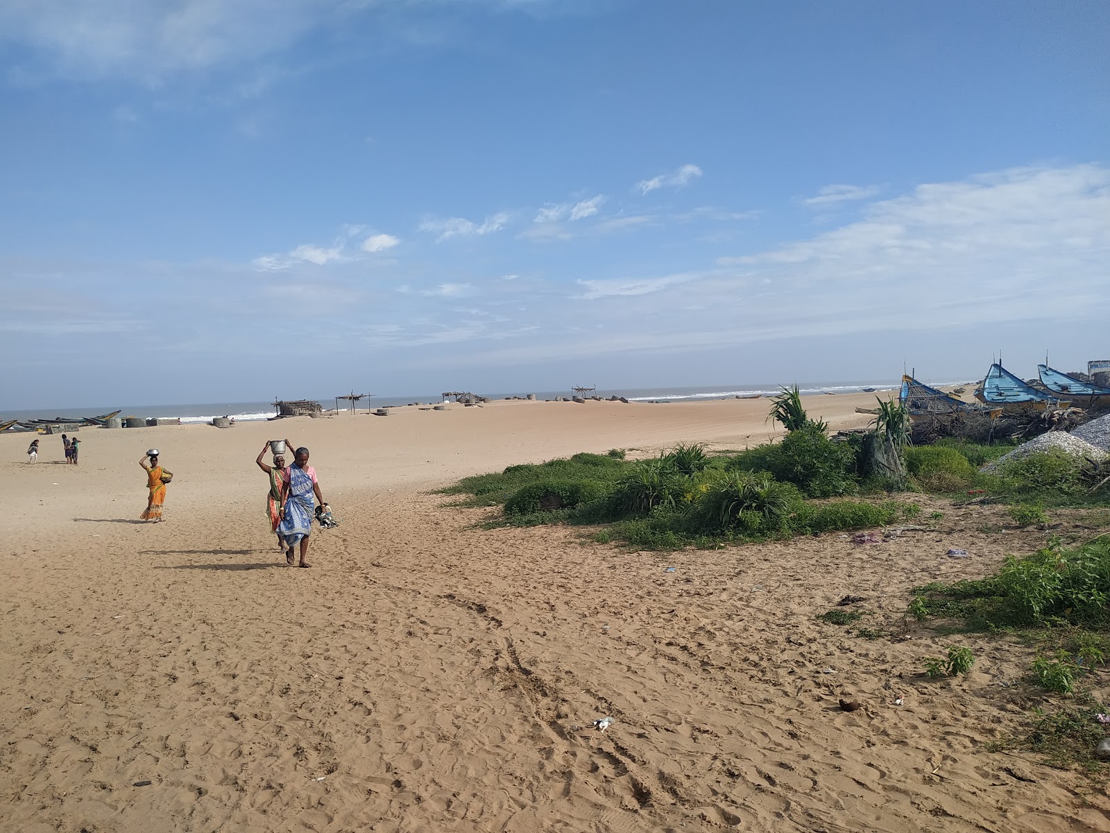 Foto av Kapasukuddi Beach med beige sand yta