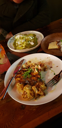Salmon with roasted cauliflower & Shrimp Enchiladas w/green Salsa. Amazing