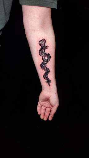 Explore pooh tattoo ideas, creative tattoo ideas in Stevens Point, available at International Ink Tattoos