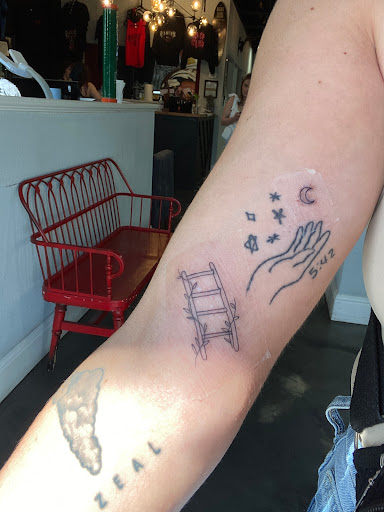 Explore cover up ideas for name tattoos, creative tattoo ideas in Dallas, available at Sinners Tattoo Studio and Supply