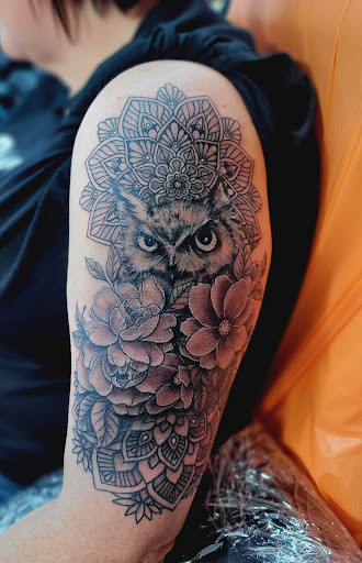 Explore neck tattoo ideas for females, creative tattoo ideas in Benton, available at Spectrum Tattoo