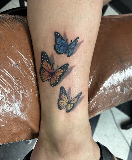Explore pretty flower tattoo ideas, creative tattoo ideas in Addison, available at Rising Phoenix Tattoo and Body Piercing