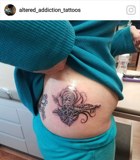 Explore middle of boob tattoo ideas, creative tattoo ideas in Hudson Falls, available at ALTERED ADDICTION TATTOOS