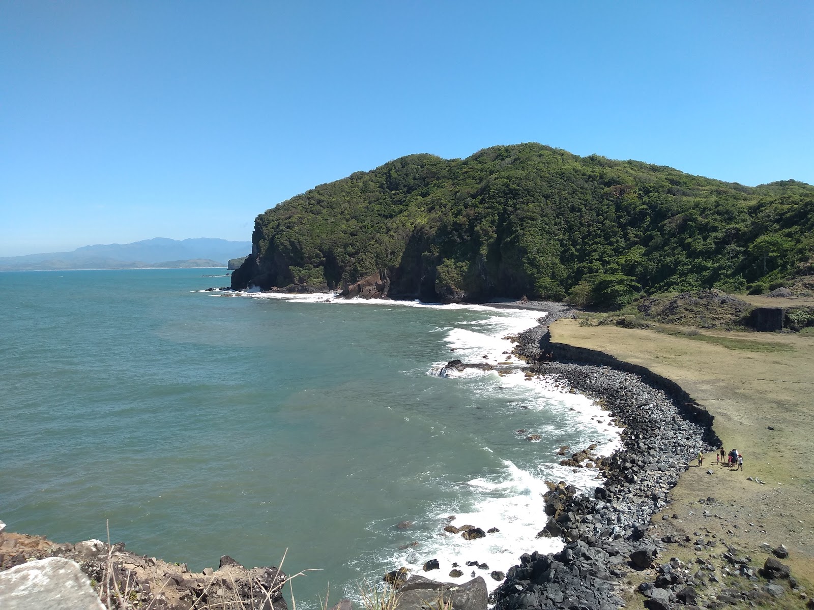 Photo de Playa Fantasma protégé par des falaises