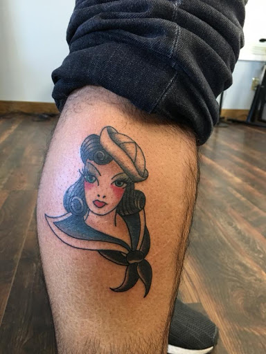 Explore last name back tattoo ideas, creative tattoo ideas in Delmar, available at Resolute Tattoo