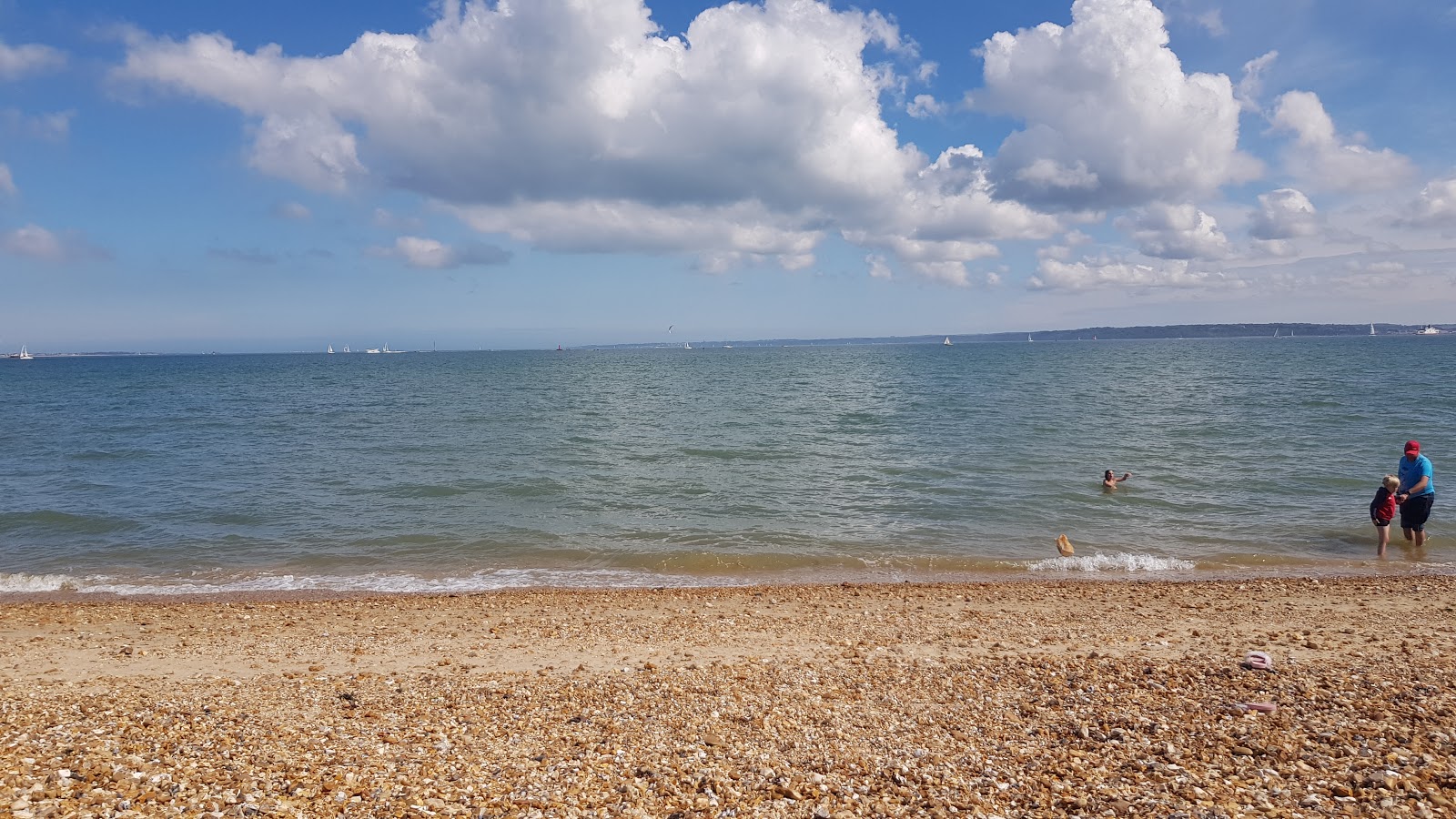 Photo of Calshot Beach with blue water surface