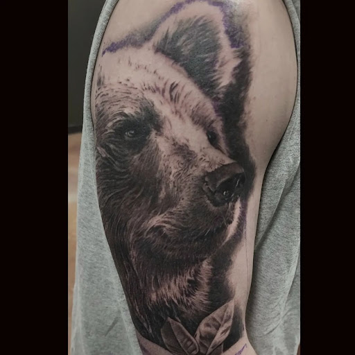 Explore blacked out tattoo ideas, creative tattoo ideas in Wasilla, available at Twin Ravens Tattoo