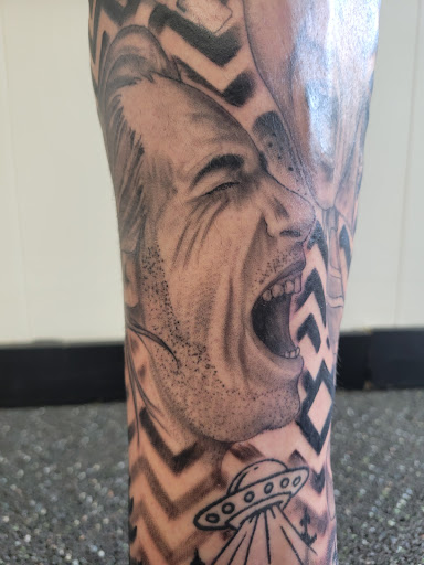 Explore black and white sleeve tattoo ideas, creative tattoo ideas in Algoma, available at Shipwreck Tattoo