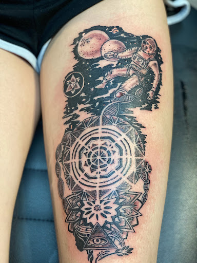 Explore ouija tattoo ideas, creative tattoo ideas in Pikeville, available at The Carbon Canary Tattoo Studio