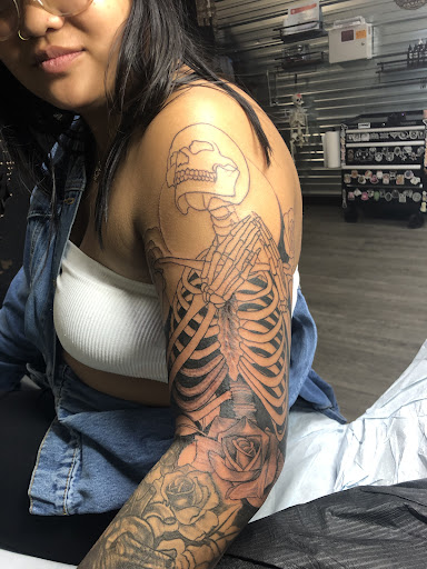 Explore lily tattoo ideas, creative tattoo ideas in Spokane, available at Platinum Rose Tattoo Studio