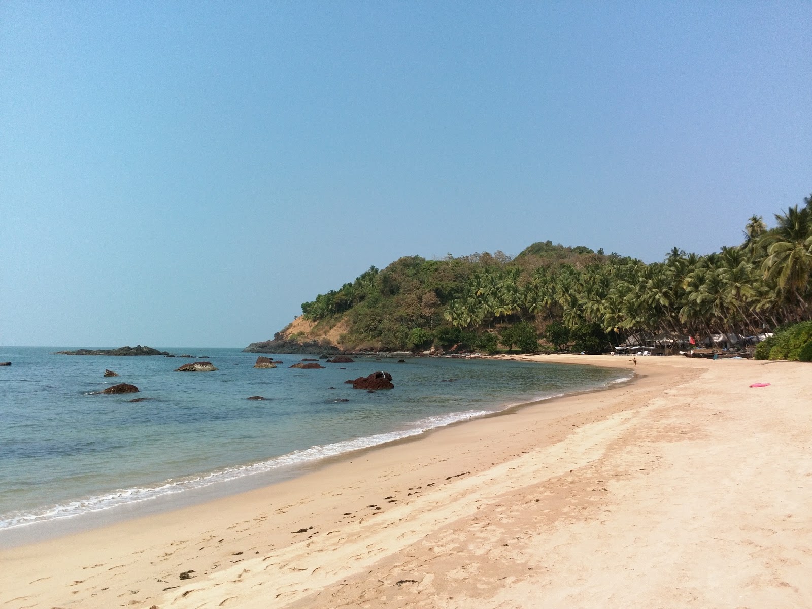 Photo de Small Cola Beach avec sable lumineux de surface