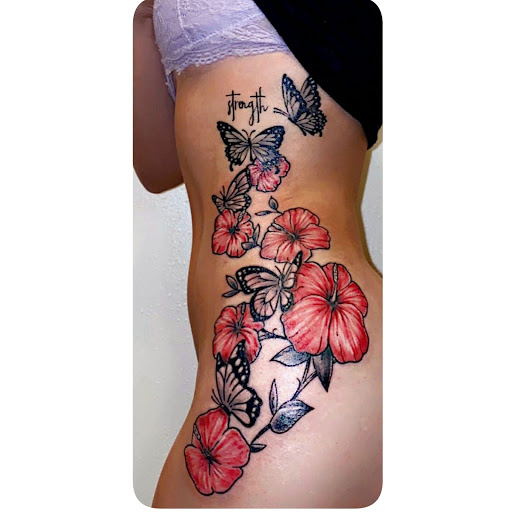 Explore surfboard tattoo ideas, creative tattoo ideas in Storm Lake, available at Alley Cat Tattoo