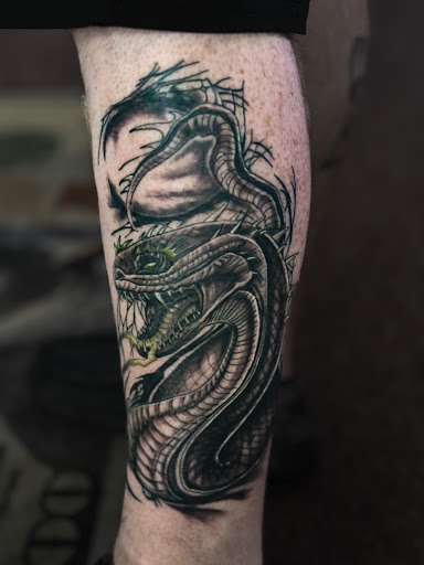 Explore tattoo thigh ideas, creative tattoo ideas in West Union, available at Status Tattoo