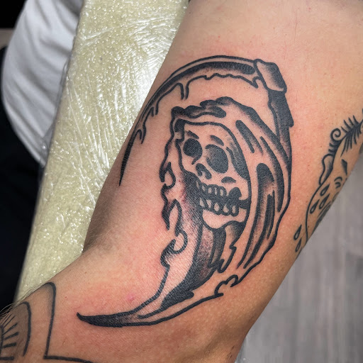 Explore sticker sleeve tattoo ideas, creative tattoo ideas in Buffalo, available at True Gloom Tattoo Studio