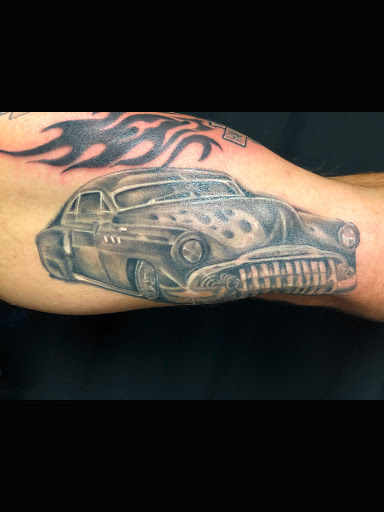 Explore campfire tattoo ideas, creative tattoo ideas in Greenfield, available at Tattoos In Time Studio