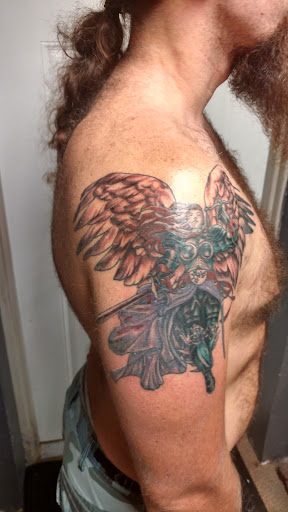 Explore side finger tattoo ideas, creative tattoo ideas in Bloomington, available at Crimson Breed Tattoo Studio