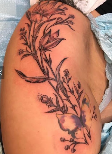 Explore pink ribbon tattoo ideas, creative tattoo ideas in Waverly, available at Hellbilly Tattoos & Oddities