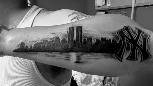 Explore spartan helmet tattoo ideas, creative tattoo ideas in Lewiston, available at Altered Image Tattoo Studio