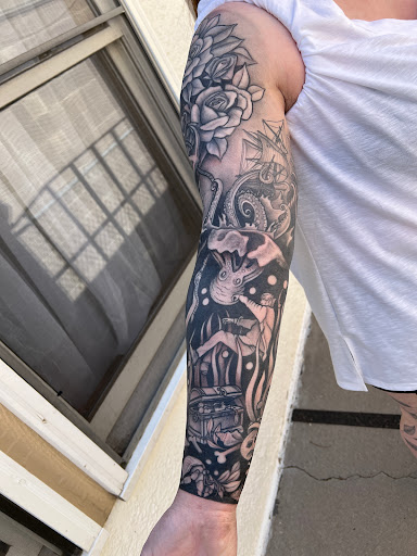 Explore thigh flower tattoo ideas, creative tattoo ideas in Grand Junction, available at Monarch Tattoo Studio