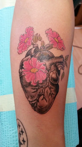 Find palm size tattoo ideas for females for your next unique tattoo in Puyallup at The Tattoo Shop
