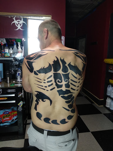 Explore mens upper arm tattoo ideas, creative tattoo ideas in Du Bois, available at Primitive Addiction Tattoo Studio