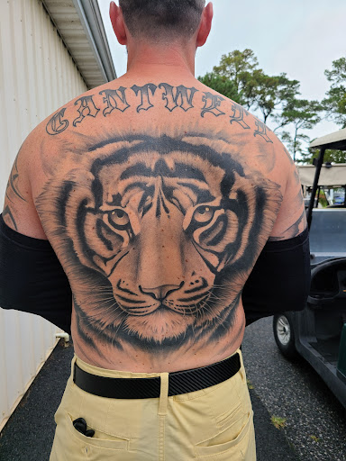 Explore rib tattoo ideas men, creative tattoo ideas in Laurel, available at Ambitious Creations Tattoo and Piercing Studio