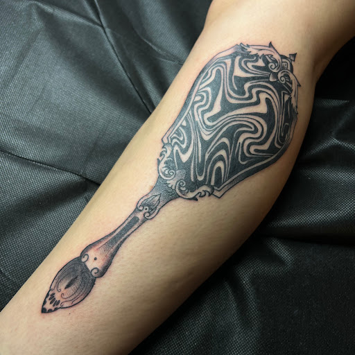 Explore lip tattoo ideas for men, creative tattoo ideas in Buffalo, available at True Gloom Tattoo Studio