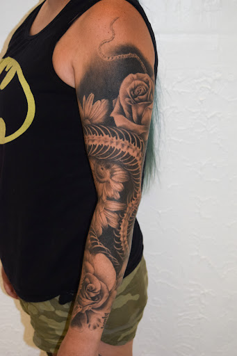 Explore flower foot tattoo ideas, creative tattoo ideas in Sparta, available at Black Sheep Studios