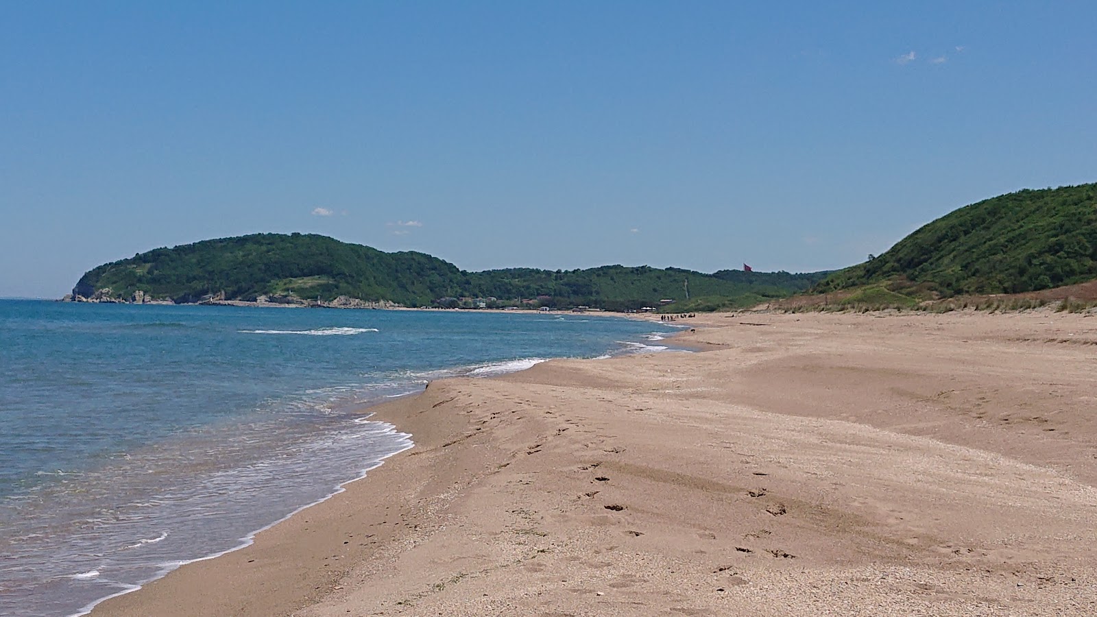 Foto von Suayipli Koyu Plaji mit heller sand Oberfläche