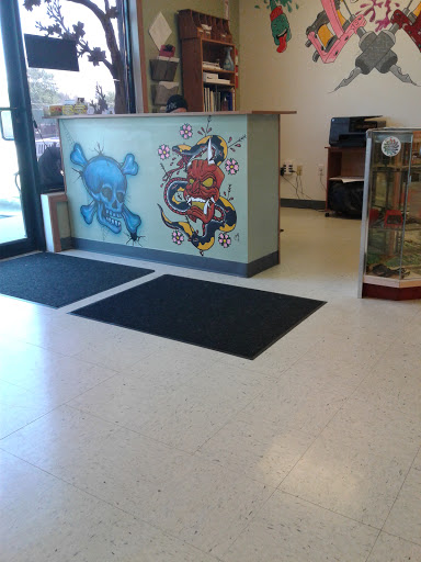 Explore jesus sleeve tattoo ideas, creative tattoo ideas in Bradley, available at Rogers Tattooing & Body Piercing