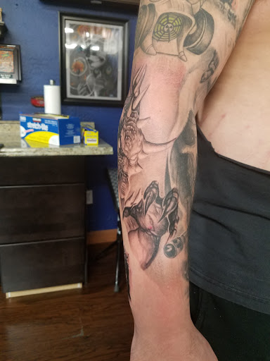 Explore hand tattoo ideas, creative tattoo ideas in Glendale, available at Knucklehead Tattoo Shop