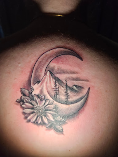 Explore men's rib tattoo ideas, creative tattoo ideas in Angola, available at Hoodlum Ink