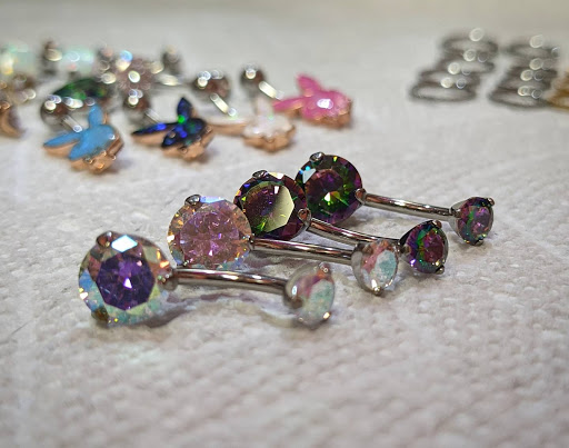 Explore dainty spine tattoo ideas, creative tattoo ideas in Columbiana, available at AllieCat Piercing