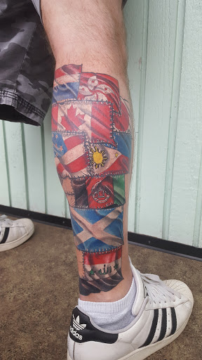 Explore cross tattoo ideas for guys, creative tattoo ideas in Olympia, available at Fleshworks Tattoo Studio