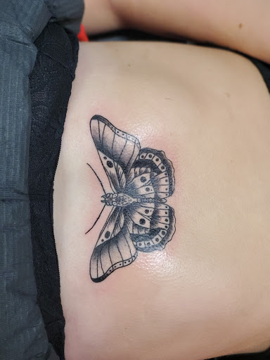Find angel tattoo ideas for females for your next unique tattoo in Bowling Green at The Mad Tatter, L.L.C.