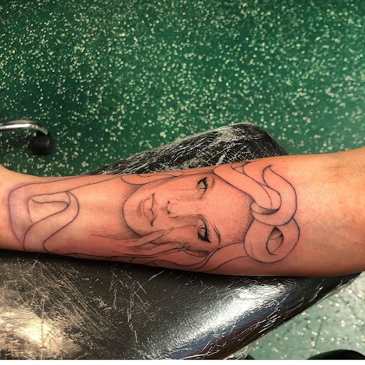 Explore tattoo ideas for weightlifters, creative tattoo ideas in Vancouver, available at Studio X Tattoos & Piercings