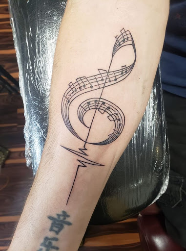 Explore heart locket tattoo ideas, creative tattoo ideas in Flint, available at Black Eye Social Club Tattoo