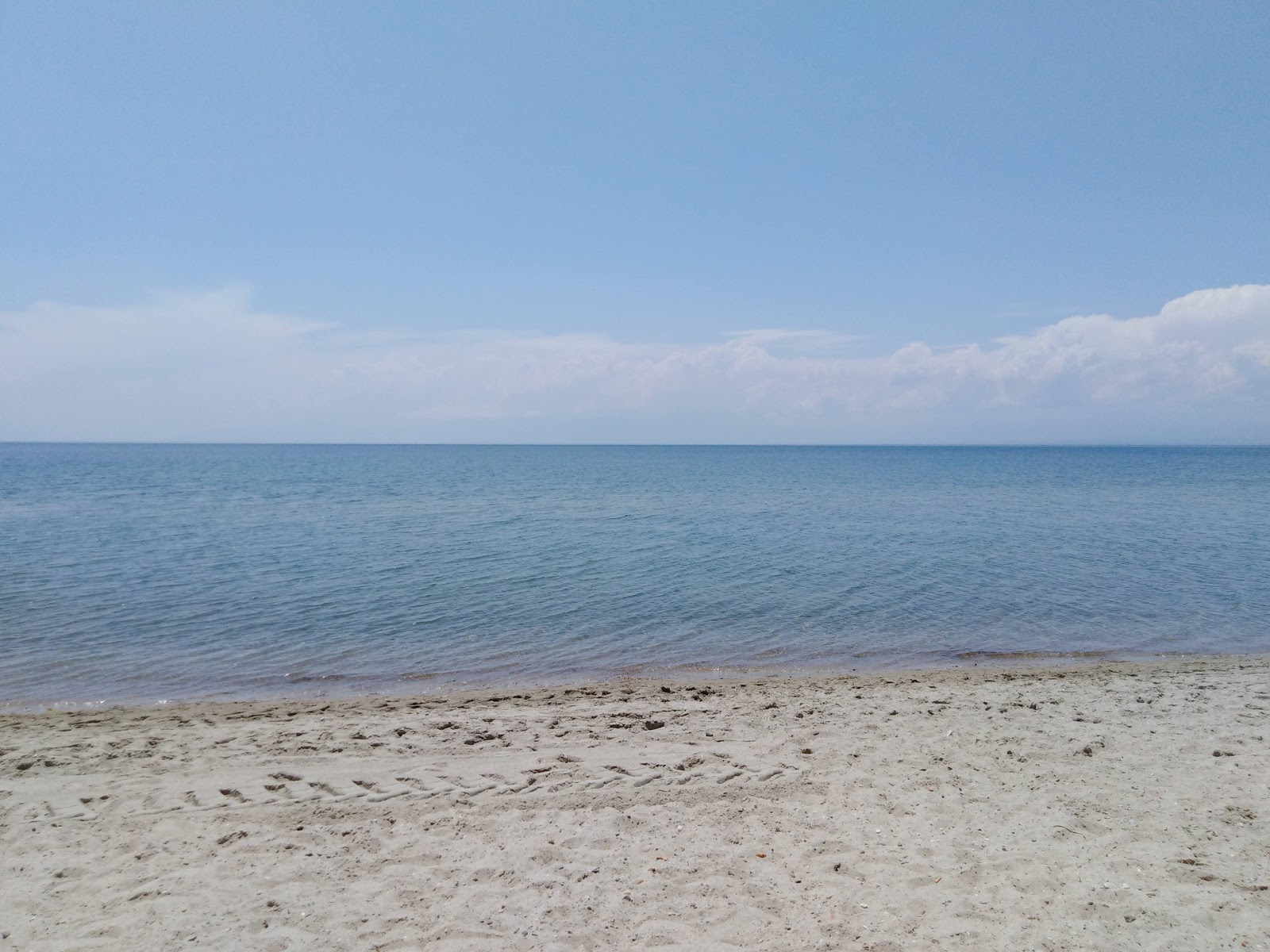 Photo de Kyma beach avec sable clair avec caillou de surface