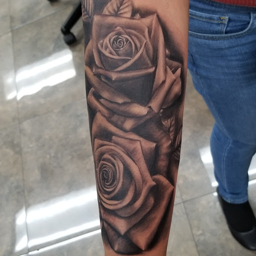 Explore hood tattoo ideas, creative tattoo ideas in Colton, available at knuckleheads tattoo