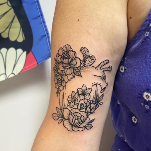 Explore flower back tattoo ideas, creative tattoo ideas in Kenosha, available at Kenosha Tattoo Company
