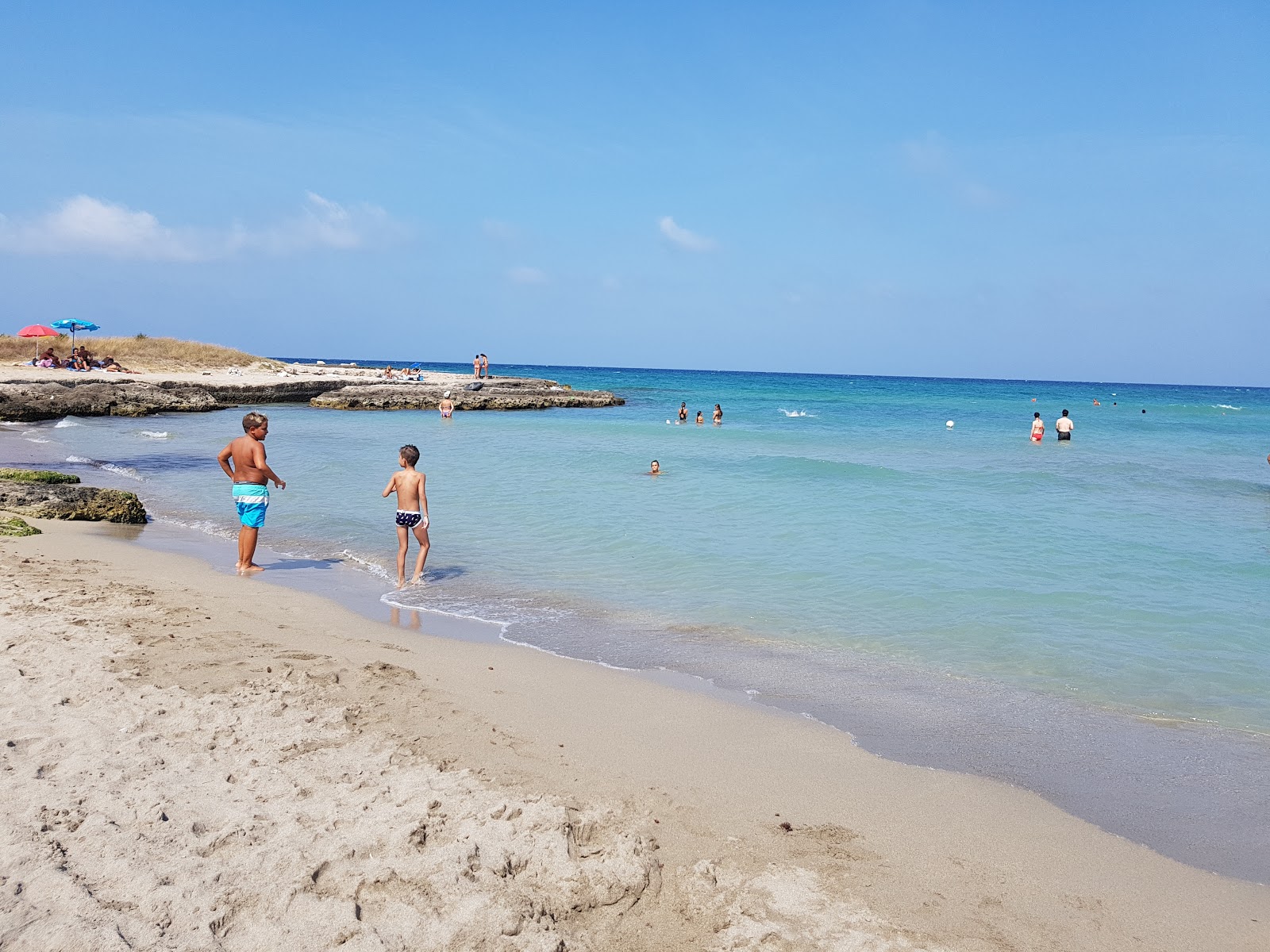 Foto av Spiaggia Mezzaluna med liten vik